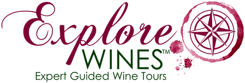 Explore Wines wordmark with a wine-stain compass. Expert Guided Wine Tours.